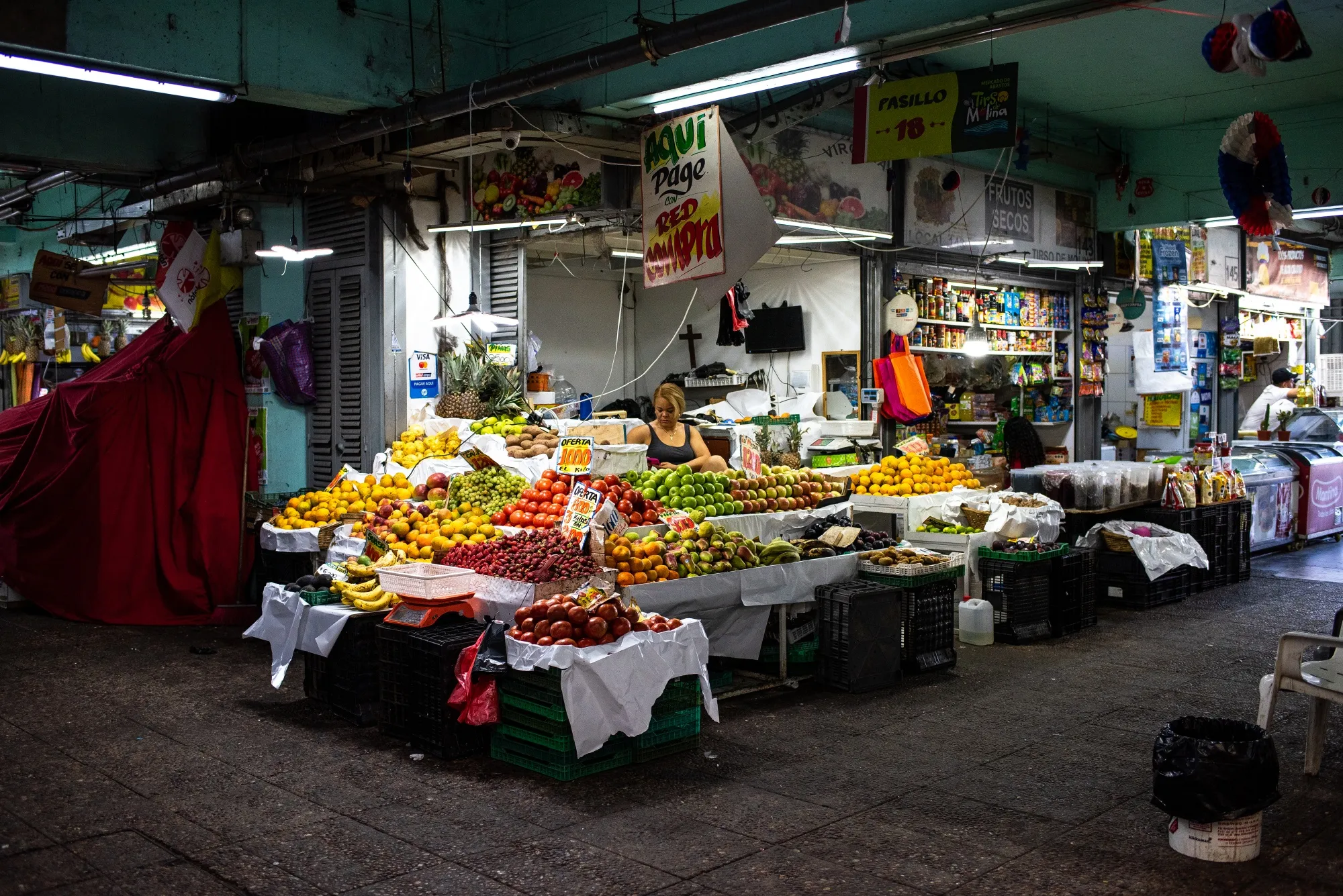 A vendor at La Vega Central fruit and vegetable market in Santiago, Chile