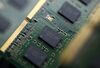 Micron Technology Inc. Double-Data-Rate Synchronous Random-Access Memory (SDRAM) chips are arranged for a photograph in Tokyo, Japan, on Wednesday, July 15, 2015. The investment arm of one of China\'s top universities is planning to offer $23 billion for chipmaker Micron Technology, a person familiar with the matter said, a deal that would be the largest takeover of a foreign firm by a Chinese company.