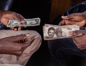 relates to (NGN/USD) Nigeria Bans Naira Street Trading as Currency Takes Another Hit