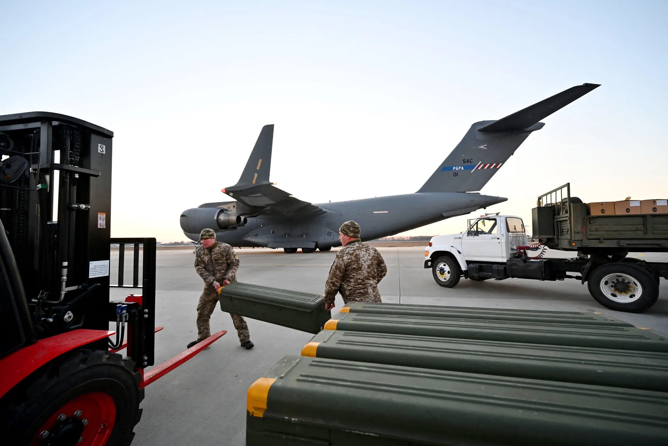 Ukrainian servicemen receive US-made Stinger missiles in Kyiv.