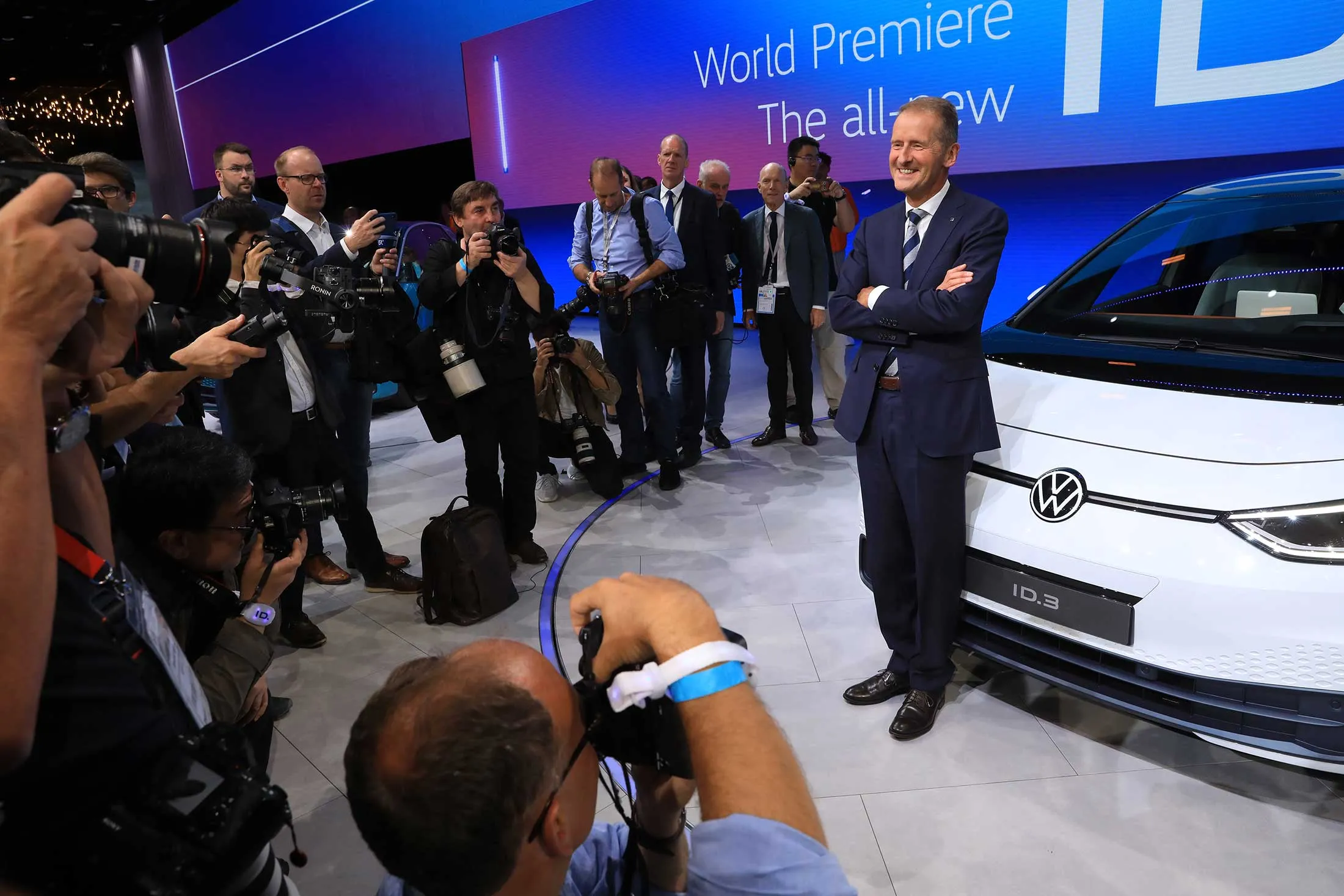 Herbert Diess, chief executive officer of Volkswagen AG, beside an ID.3 electric car in Frankfurt on Sept. 9.