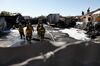 Firefighters investigate the scene of an explosion following  gas leak reports in Los Angeles, on March 17. 