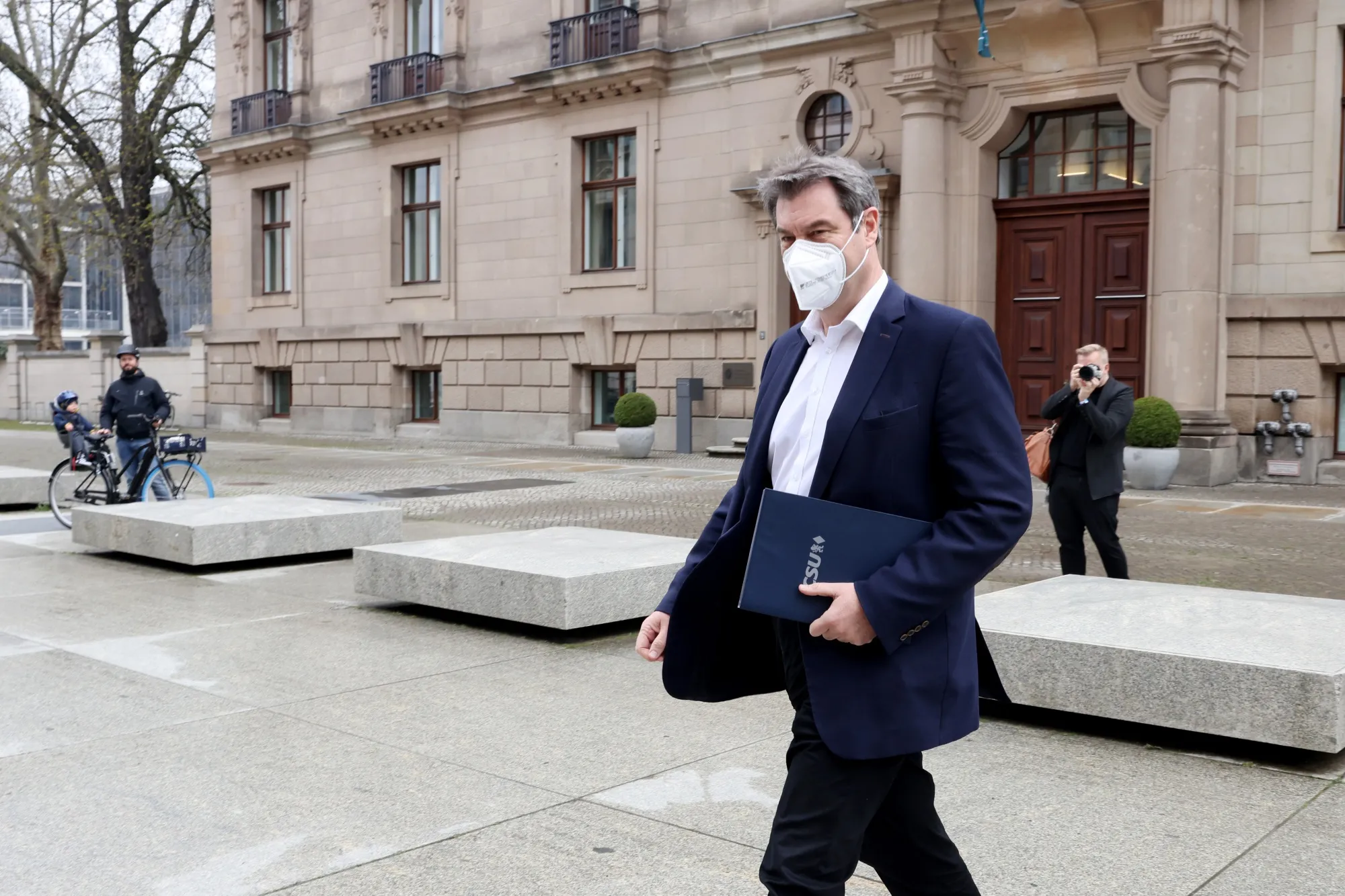 Markus Soeder arrives at the Reichstag building following a caucus meeting of Germany's ruling coalition in Berlin, April 11.
