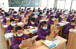 Primary school students&nbsp;on the first day of a new semester on Feb. 21, in Lianyungang, China.