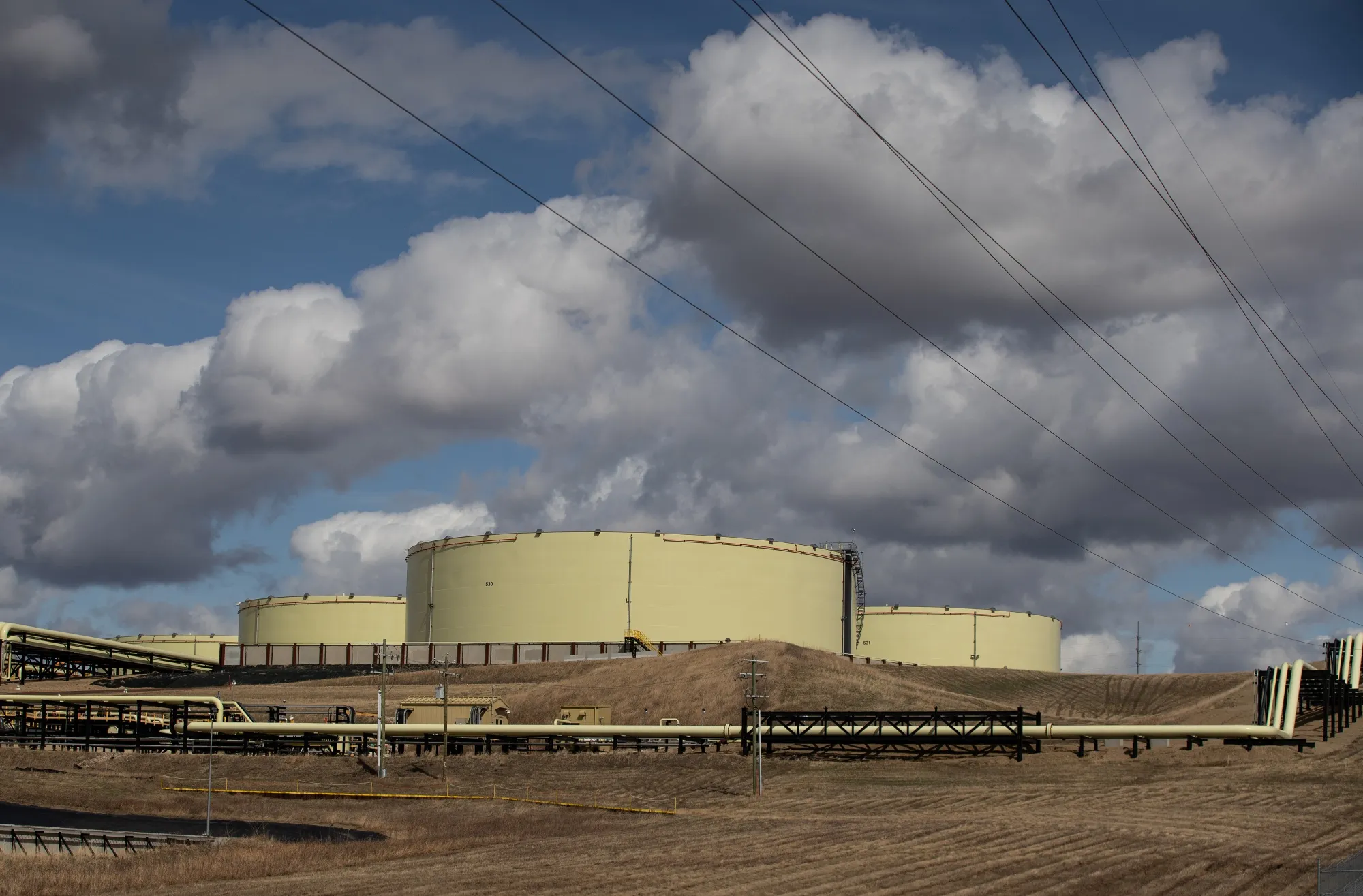 Oil storage containers and pipelines at a terminal in Hardisty, Alberta.