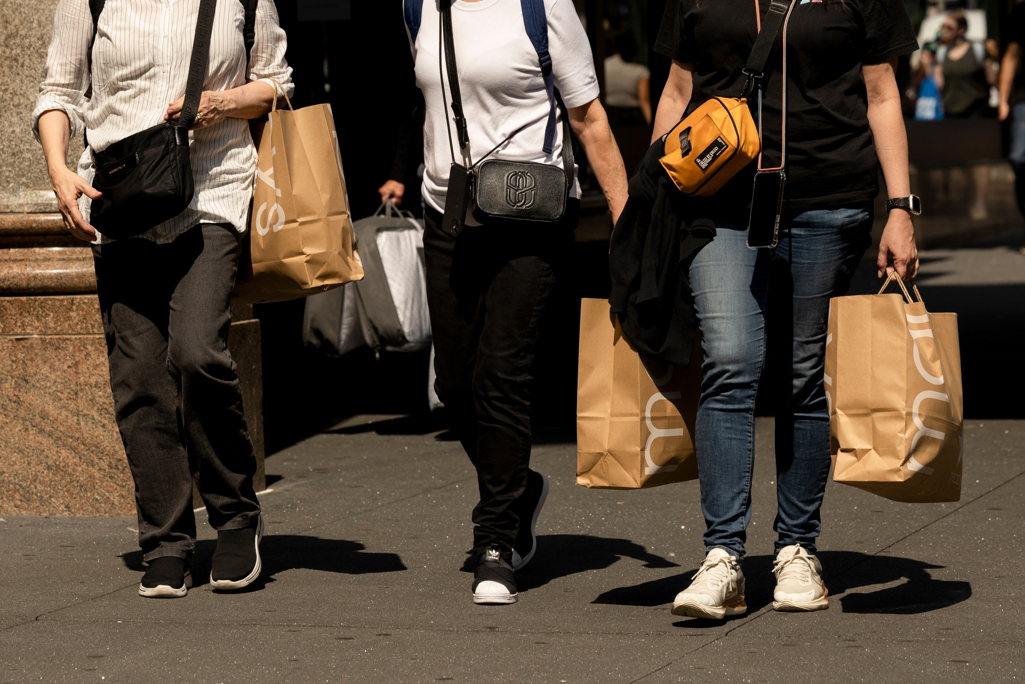 Shoppers carry Macy's bags in New York, US