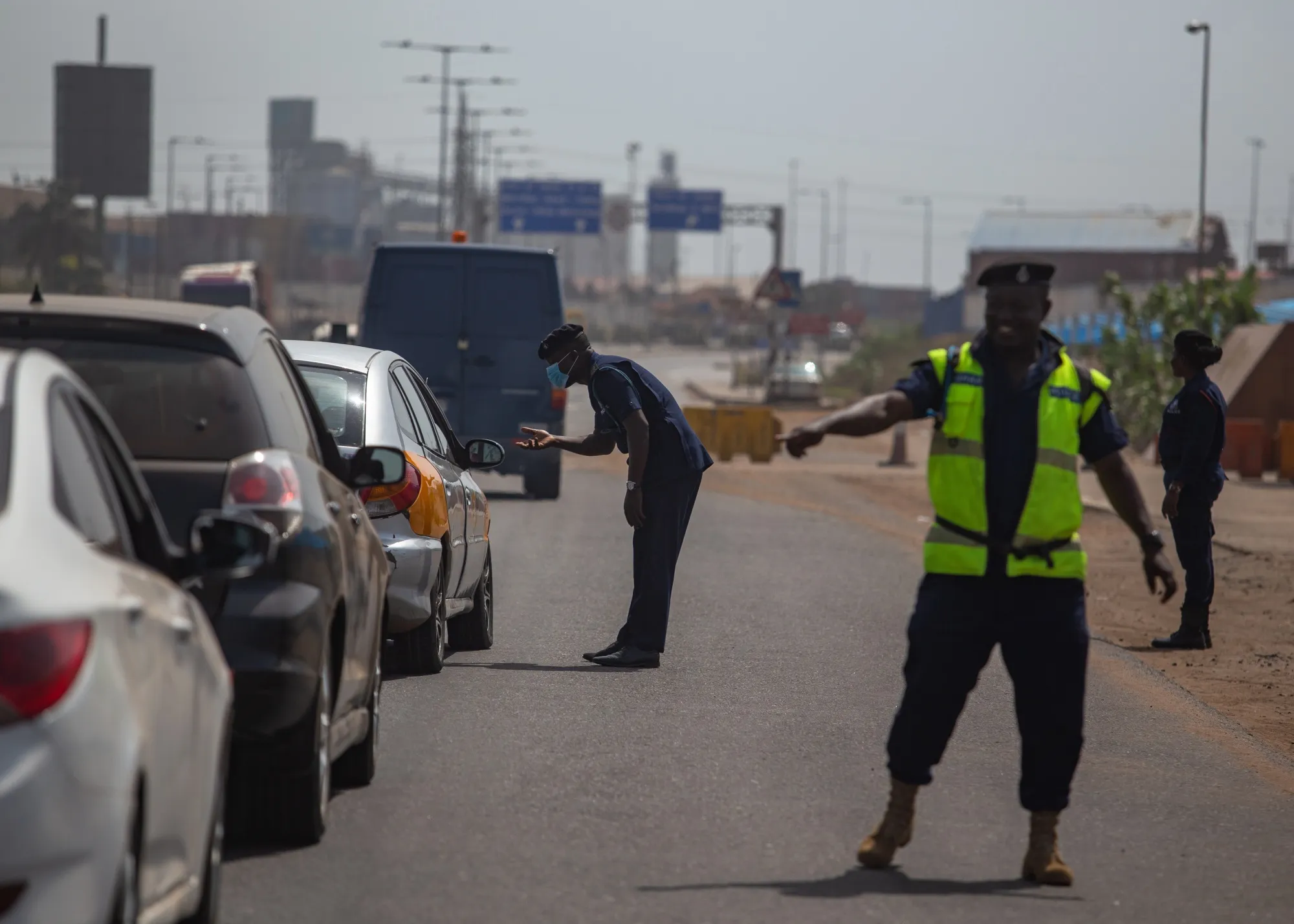 Police officers man a checkpoint in Tema, in the Greater Accra Region on March 20.