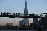 London's Shard rising behind the Millennium Bridge
