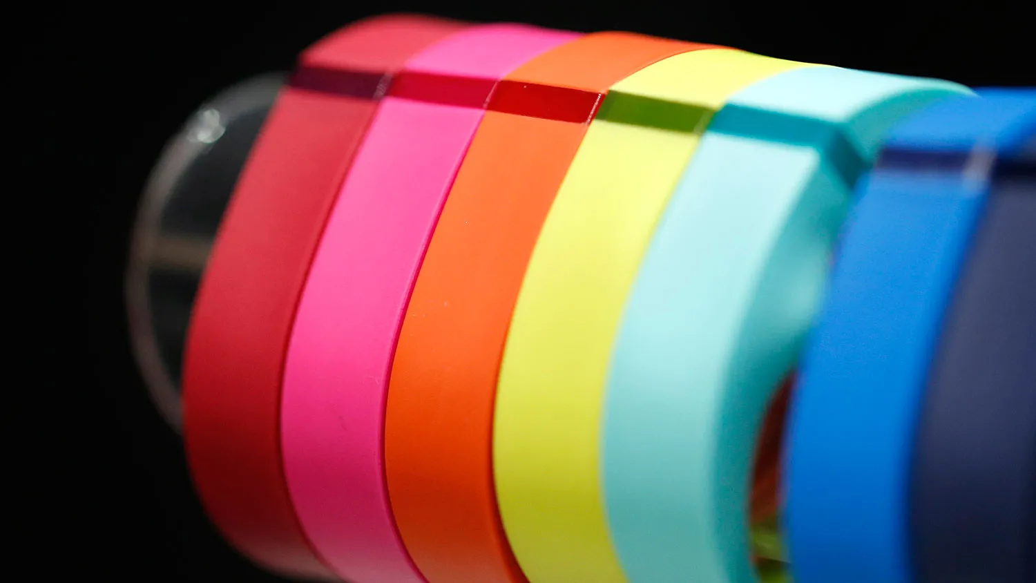 Fitbit Inc.'s Fitbit Flex wireless activity and sleep wristbands sit on display at the Wearable Expo in Tokyo on Jan. 14, 2015.
