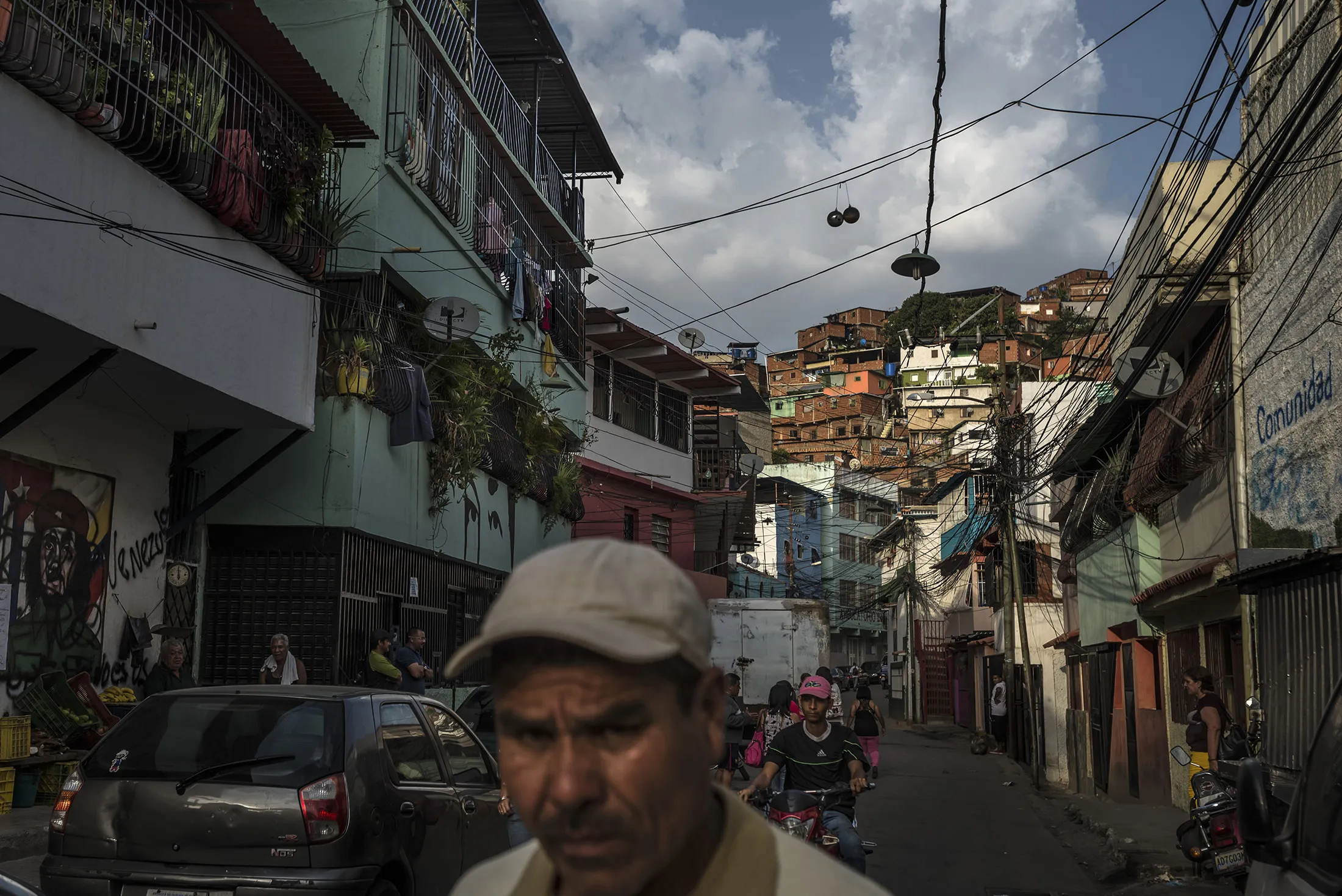 A man walks along the street in the in the Petare neighborhood on the outskirts of Caracas.
