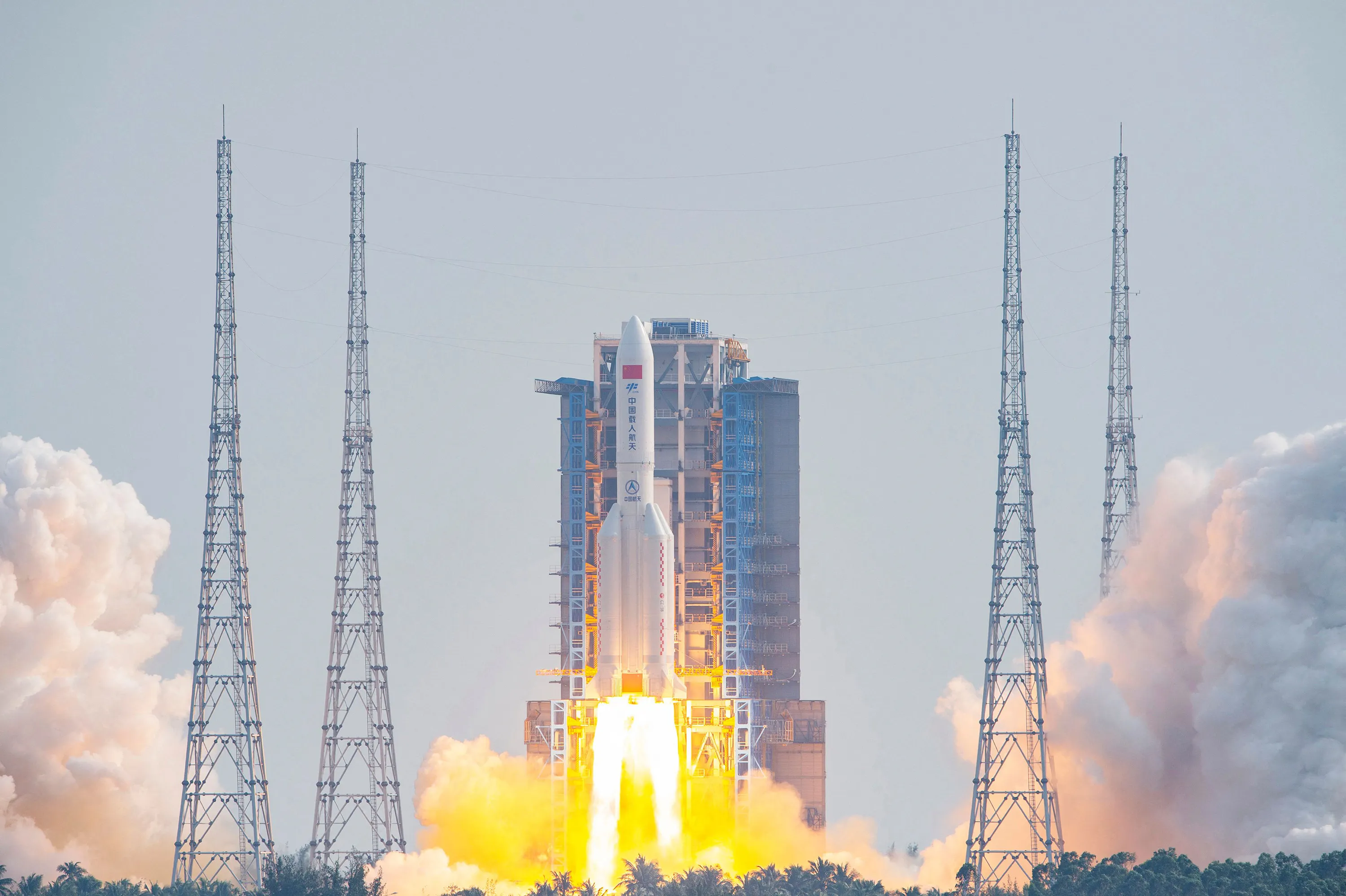 The Long March 5B rocket, carrying China's Mengtian module, lifts off.