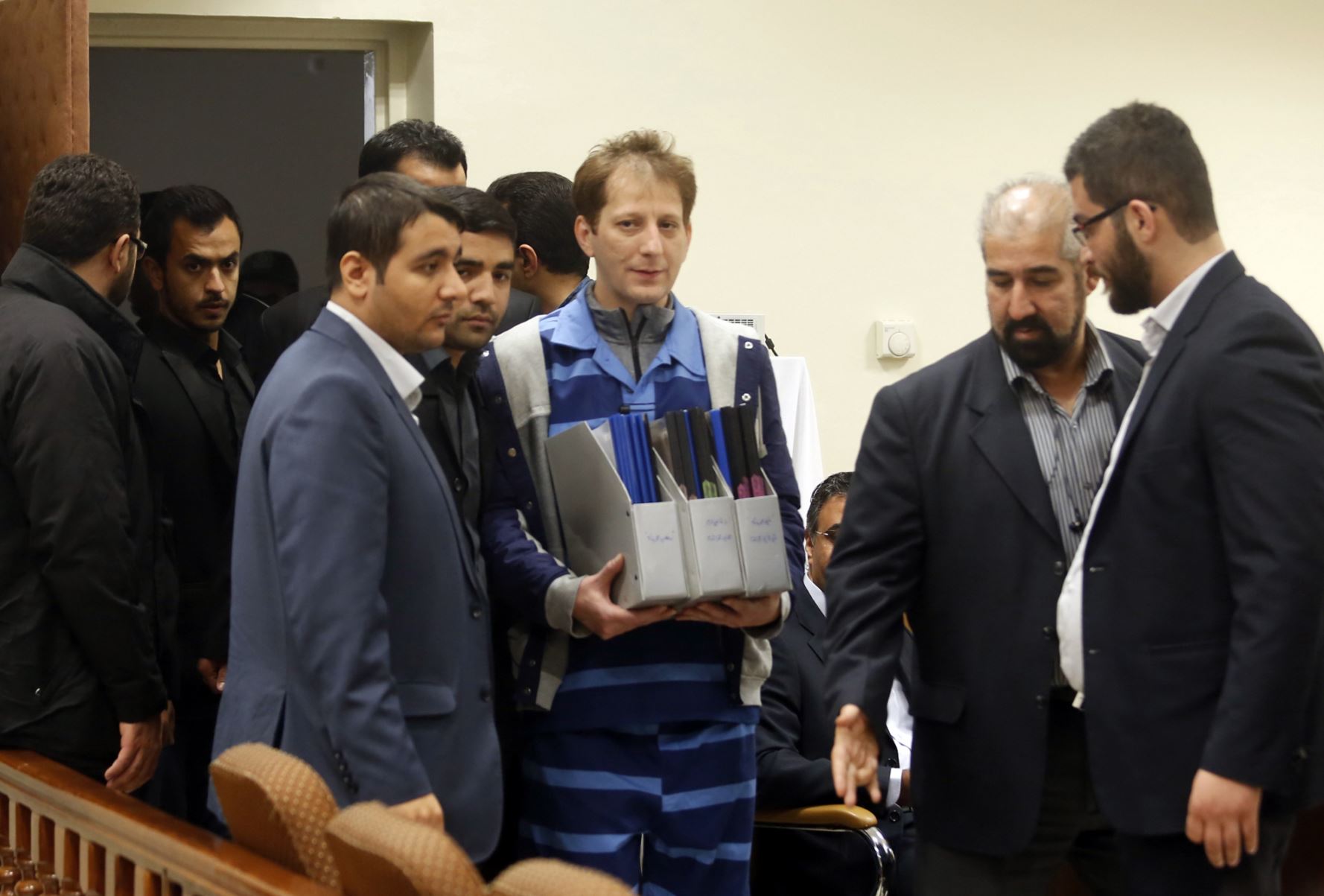 Babak Zanjani, in blue, in a Tehran court in November 2015.
