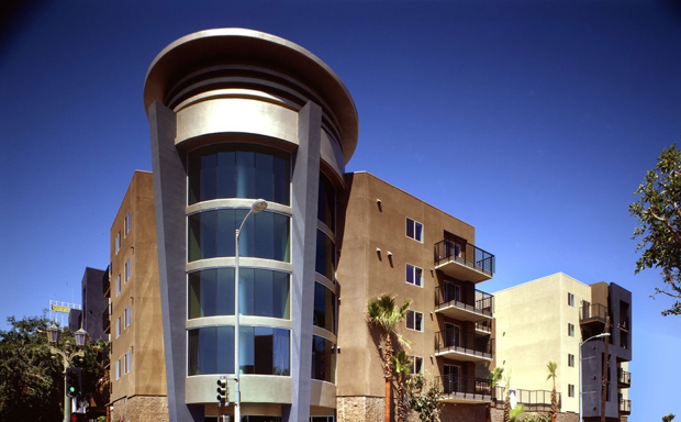 Triangle Square in West Hollywood, California, opened in 2007 as one of the first planned affordable housing communities aimed at serving aging LGBTQ people. The $21.5M facility has 104 units devoted to low-income seniors. A third of the units are reserved for seniors with HIV/AIDS or who are at risk of homelessness.