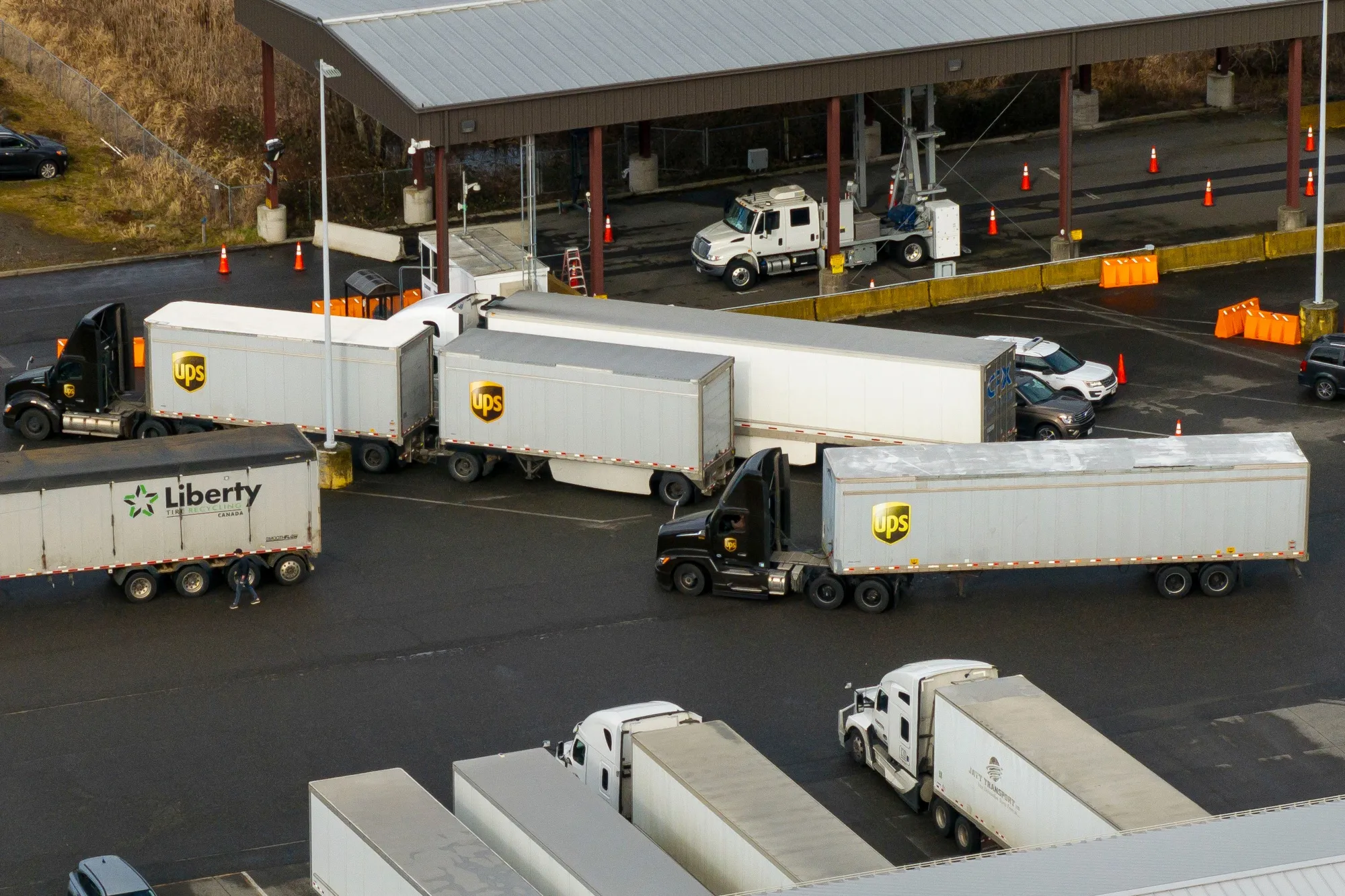 Tractor trailers entering the US from Canada at the Pacific Highway Border Crossing in Blaine, Washington.