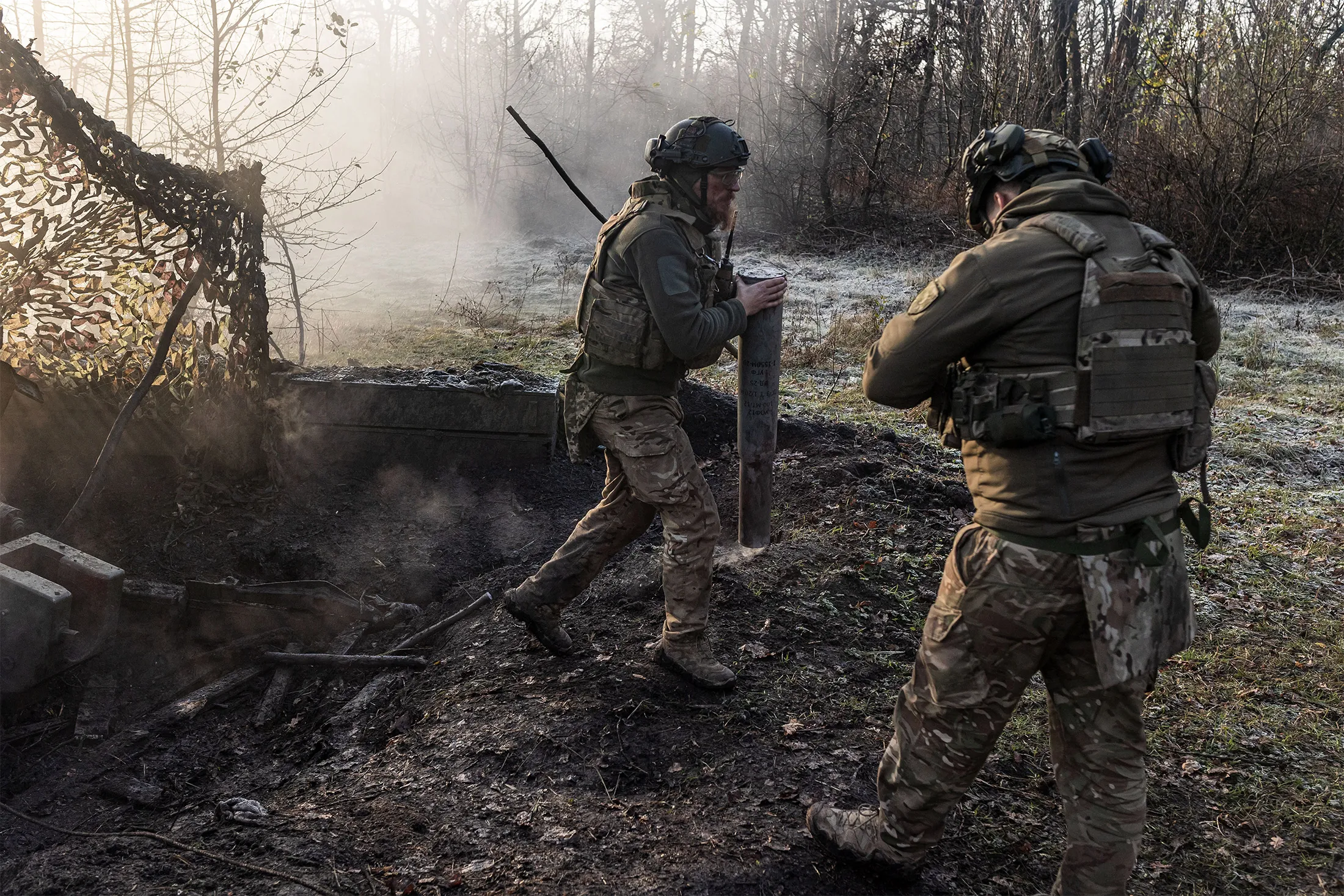 Ukrainian soldiers collect artillery shells at a position in Donetsk Oblast, Ukraine, on Nov. 11.