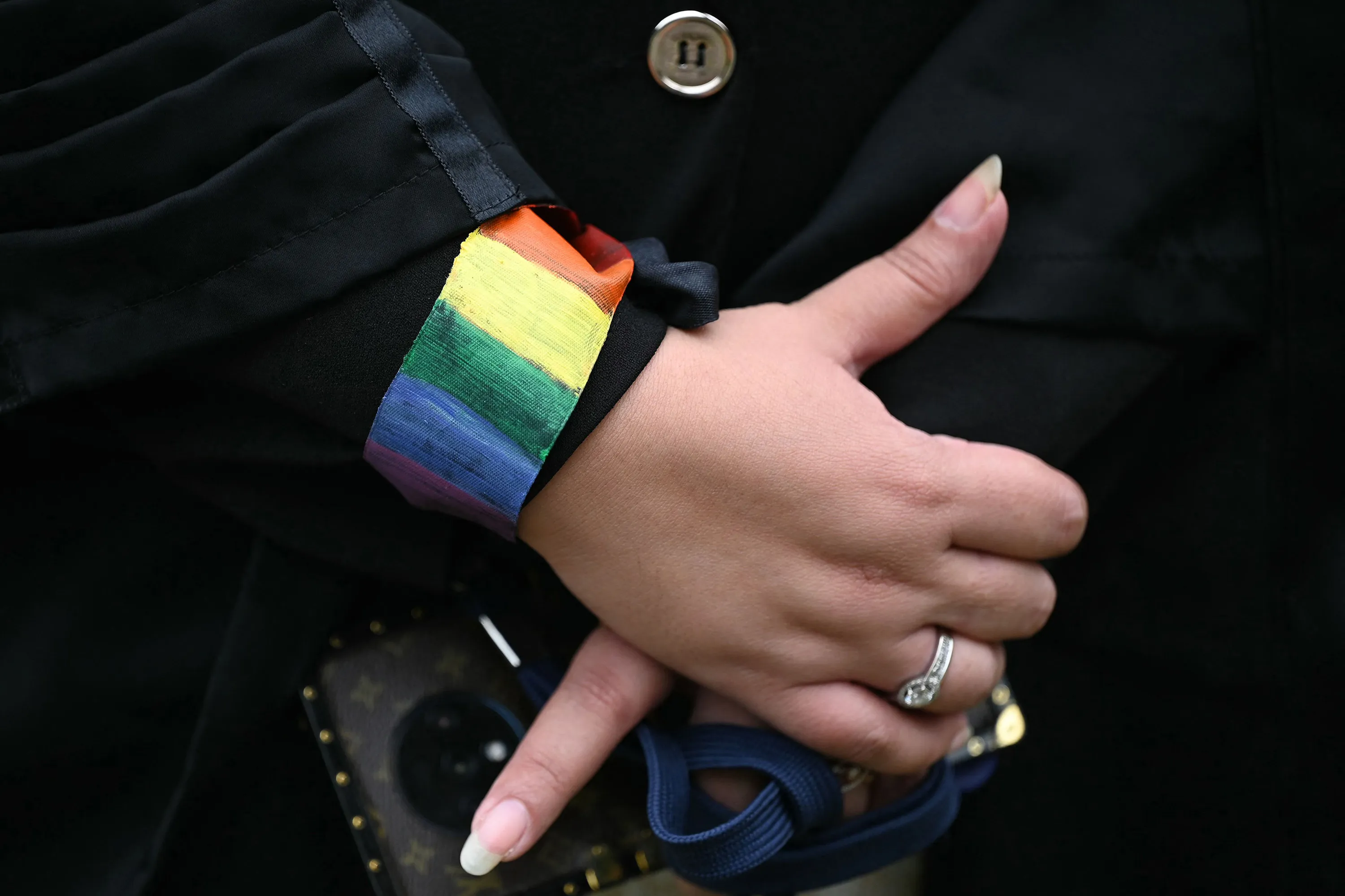 An LGTBQ activist wearing a rainbow flag wristband outside the Supreme Court in New Delhi, India, on Oct. 17.