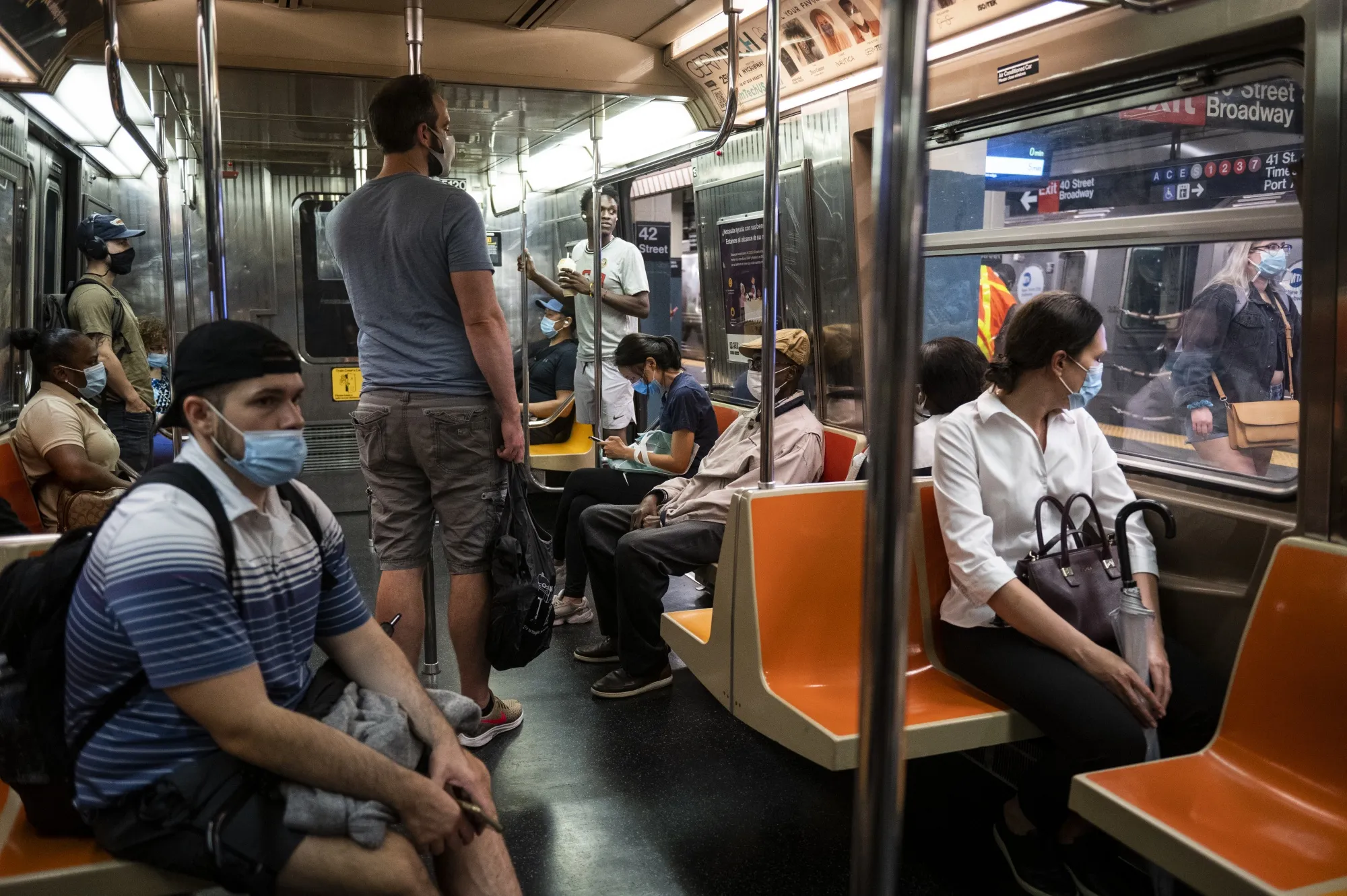 Commuters on a subway car in New York, on&nbsp;July 2.