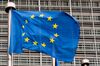 A European Union flag flies outside the Berlaymont building in Brussels, Belgium.