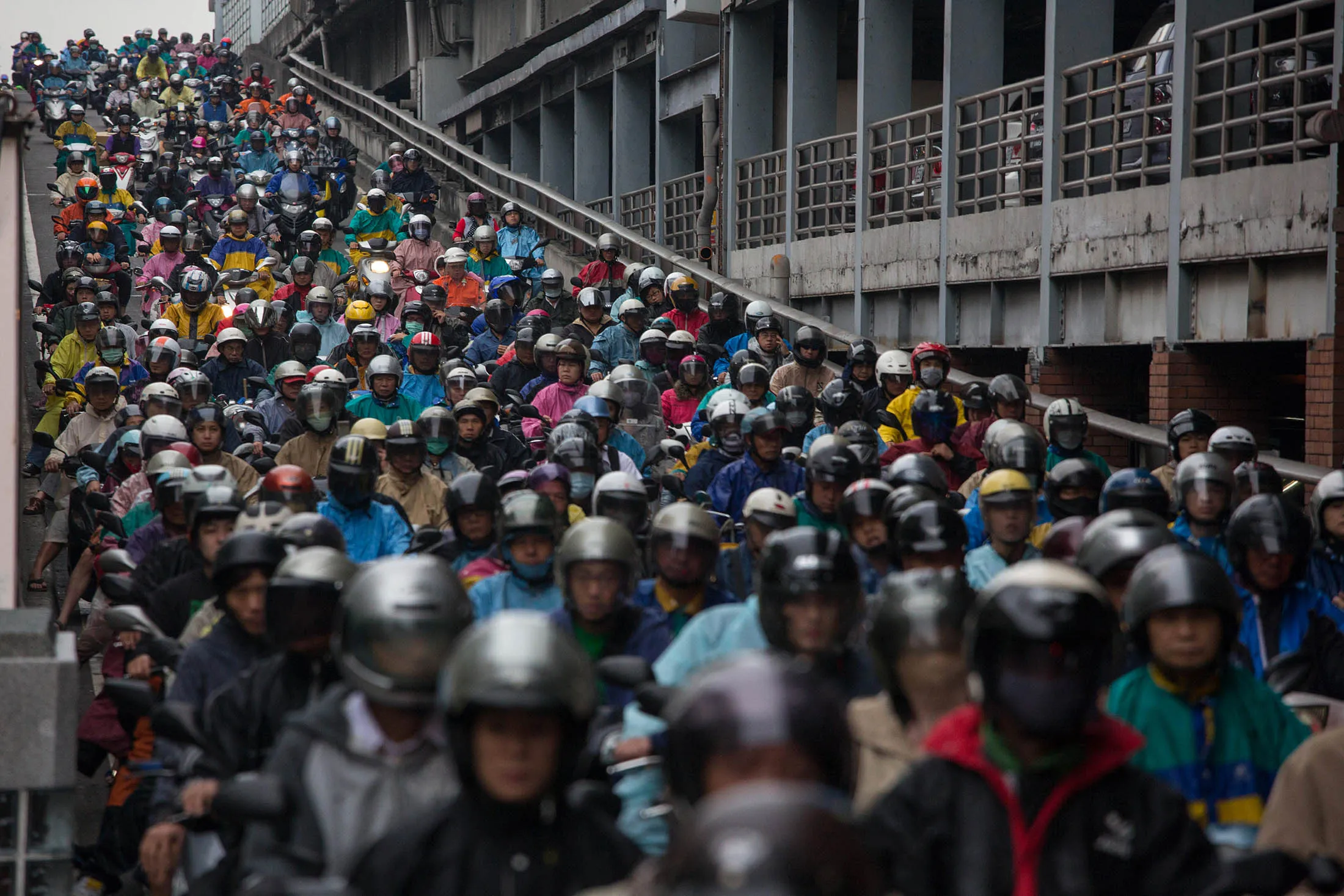 Motorcycles sit in traffic from a bridge in Taipei, Taiwan, on Monday, Nov. 4, 2013.

