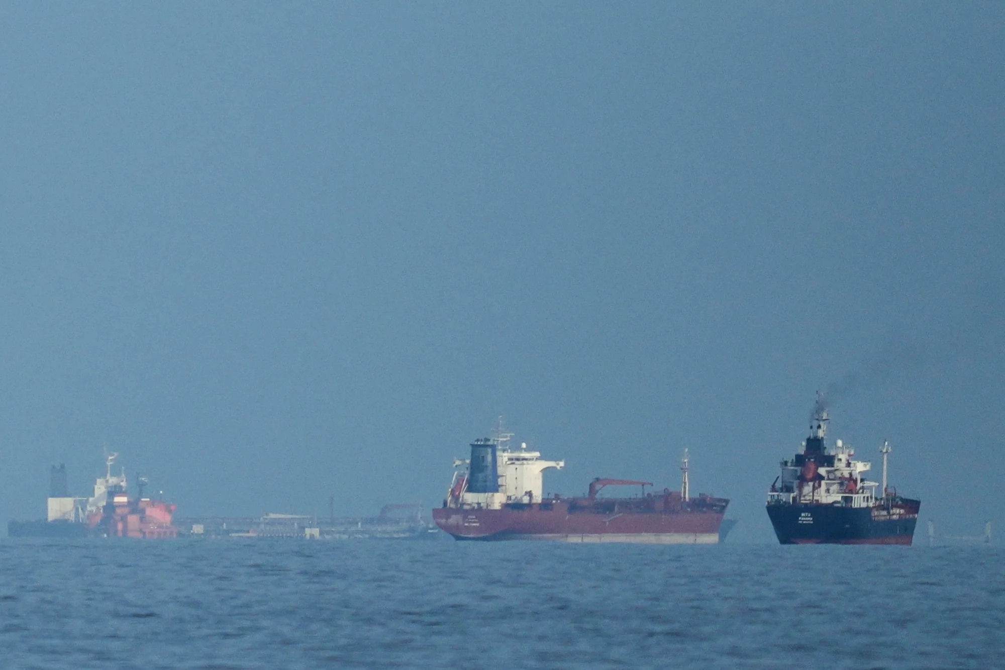 Oil tankers and cargo ships line up near the Strait of Hormuz off the coast&nbsp;of Khor Fakkan, United Arab Emirates, on March 11.