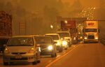 Traffic on a Colorado highway is engulfed in smoke from a wildfire in 2012.