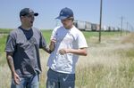Stefan Soloviev, left, and his son Quintin on ranch land in Towner, Colorado.