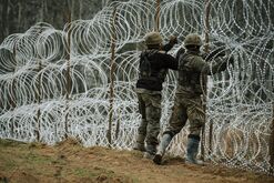 Polish soldiers construct a razor wire fence along the border with the Russian enclave of Kaliningrad. in Zerdziny, Poland