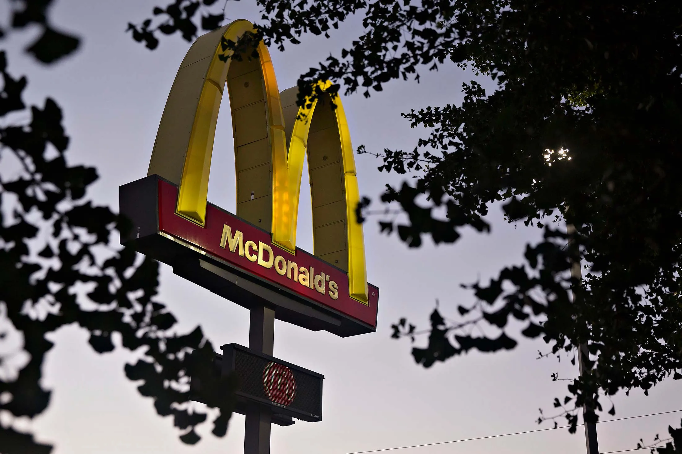 A sign stands outside a McDonald's restaurant in Peru, Illinois, U.S., on Monday, July 20, 2015.
