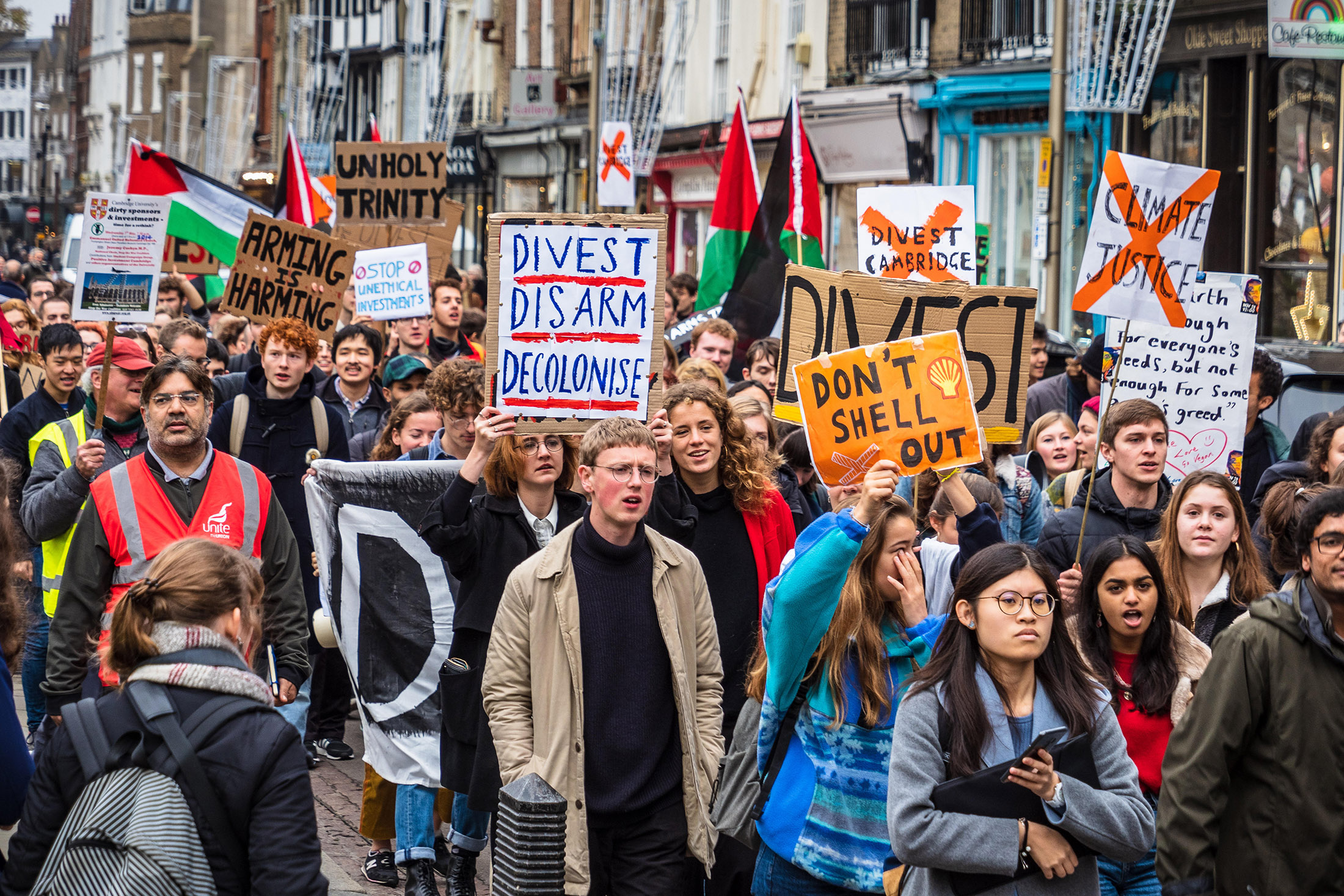 Cambridge University students march through central Cambridge demanding the university divest its unethical investments in arms and fossil fuels companies&nbsp;in 2018.