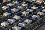 Rows of houses stand in Las Vegas, Nevada, U.S., as seen in this aerial photo taken on Tuesday, Sept. 22, 2009. The median home price in the Las Vegas area fell 40 percent to a 10-year low in August as sales of foreclosed properties cut the value of single family houses and condominiums, MDA DataQuick said.