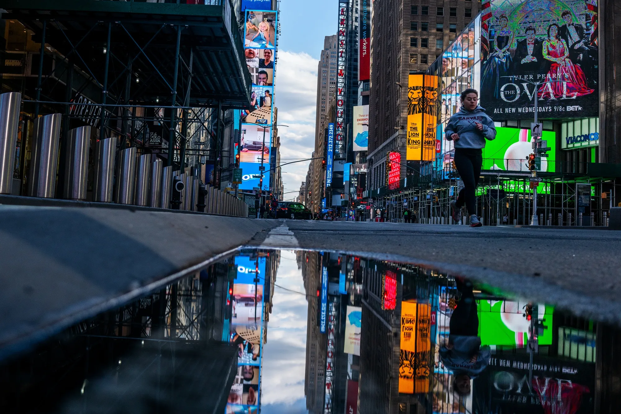A jogger runs through a nearly empty Times Square in New York on May 12.