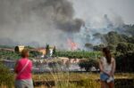 Smoke surges from vineyards in Pumarejo in&nbsp;northwest Spain on July 18.