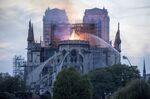 Flames and smoke rise from a fire at Notre-Dame Cathedral in Paris, France, on Monday, April 15, 2019.