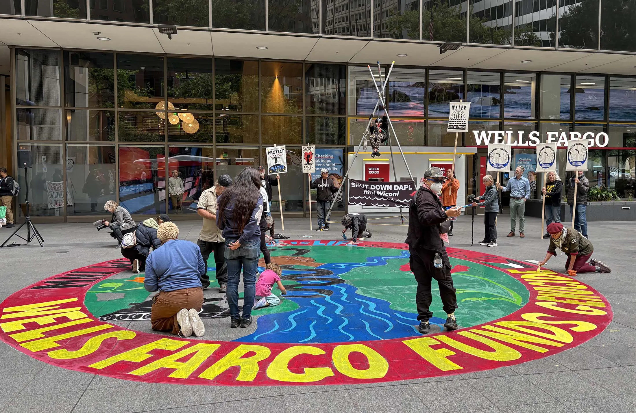 Climate activists protest outside the Wells Fargo headquarters in San Francisco on July 23.