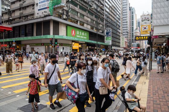 Hong Kong Plots Different Covid Path to Xi’s Zero Tolerance