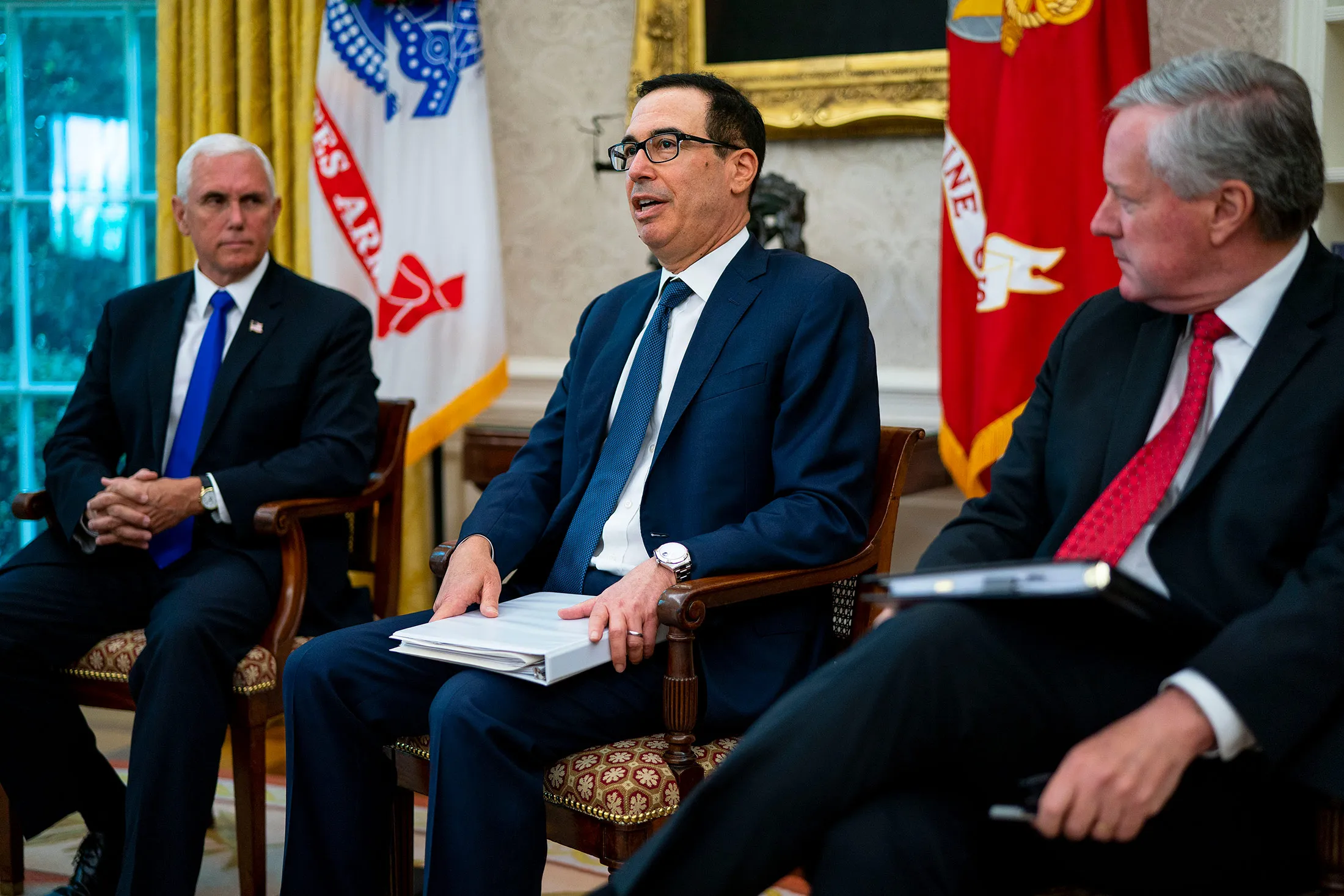 Steven Mnuchin, center, speaks during a meeting in the Oval Office at the White House in Washington, on July 20.