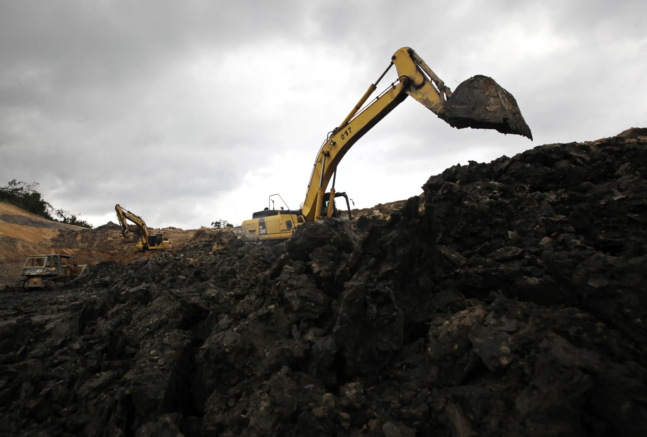 Excavators operate at the PT Exploitasi Energi Indonesia open pit coal mine in Palaran, East Kalimantan province, Indonesia.