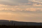 Methane gas is flared just off U.S. Route 285 near Carlsbad, New Mexico, U.S., on Tuesday, Aug. 6. 2019. New Mexico's Governor Michelle Lujan Grisham is balancing her concern over the catastrophic effects of climate change with the state's extraordinary dependence on oil and gas.
