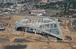 Dolan’s Forum, rear, and a $5 billion football stadium Stan Kroenke is building in Inglewood.