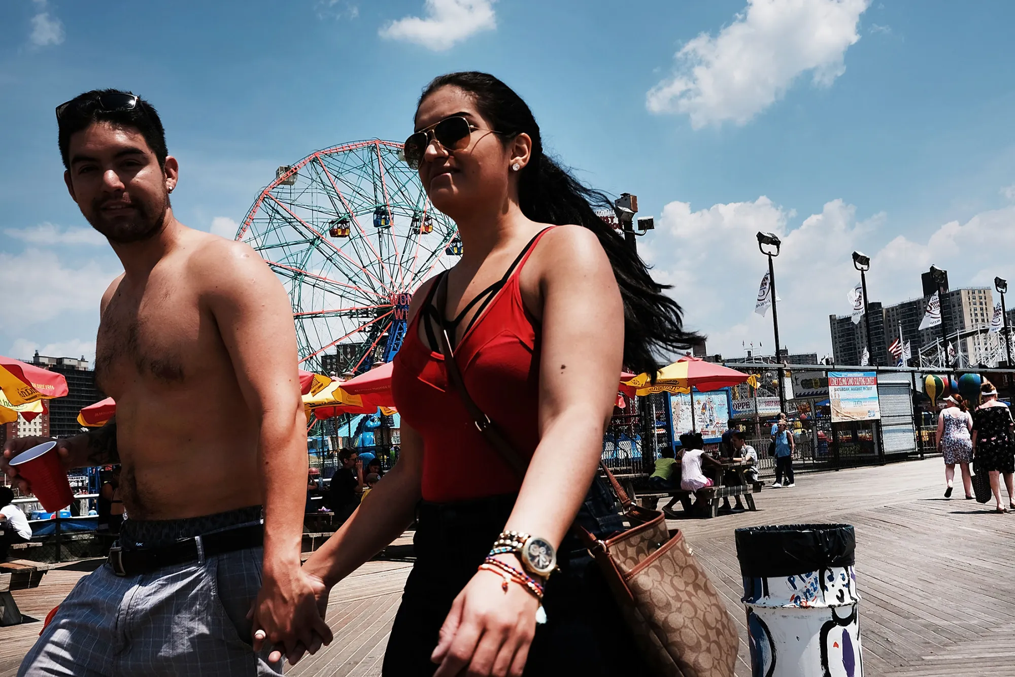 People enjoy the warm weather in New York City.
