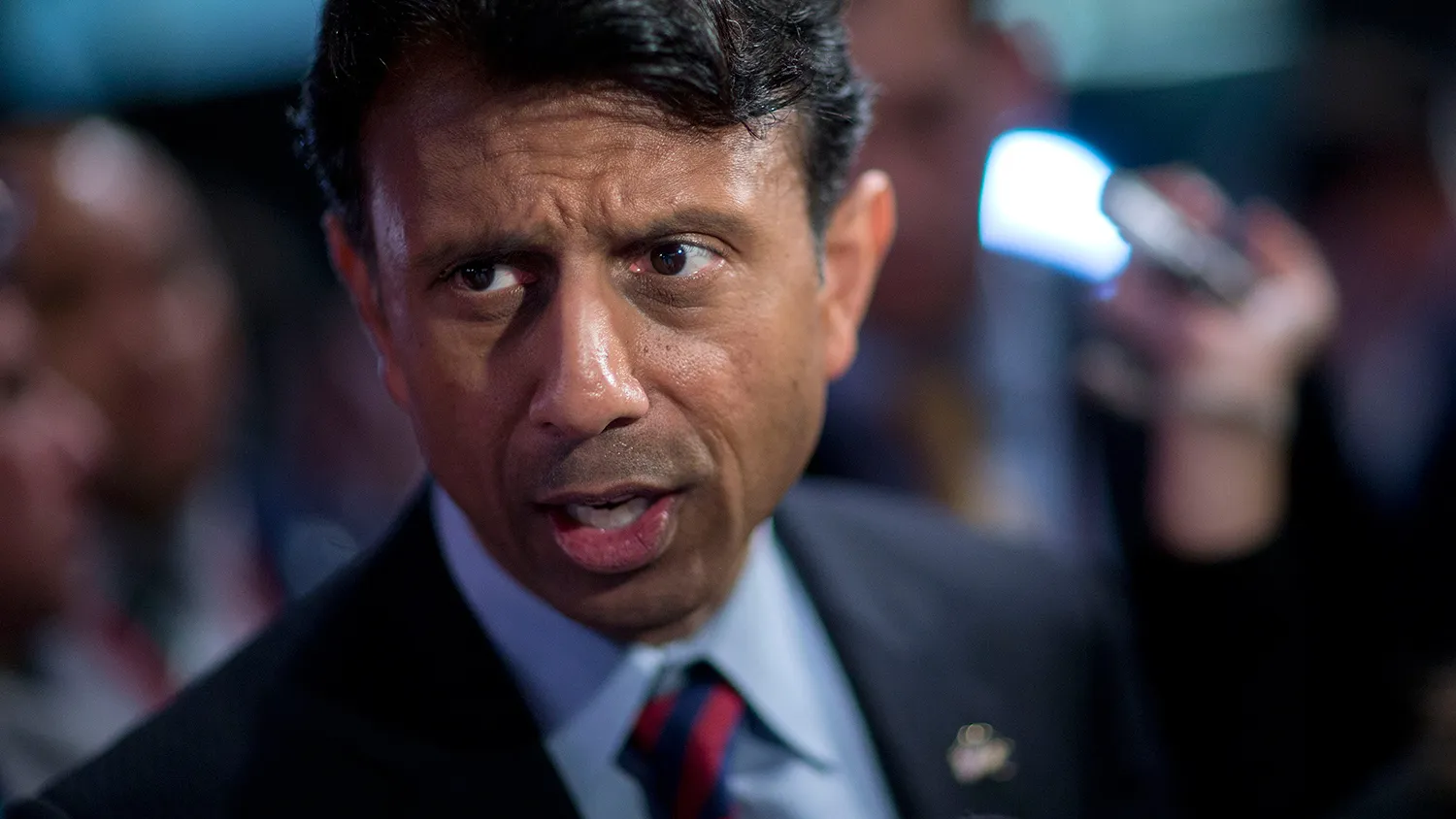 Bobby Jindal, governor of Louisiana and 2016 Republican presidential candidate, speaks to the media in the spin area after a televised forum ahead of the first Republican presidential debate at Quicken Loans Arena in Cleveland, Ohio, U.S., on Thursday, Aug. 6, 2015.
