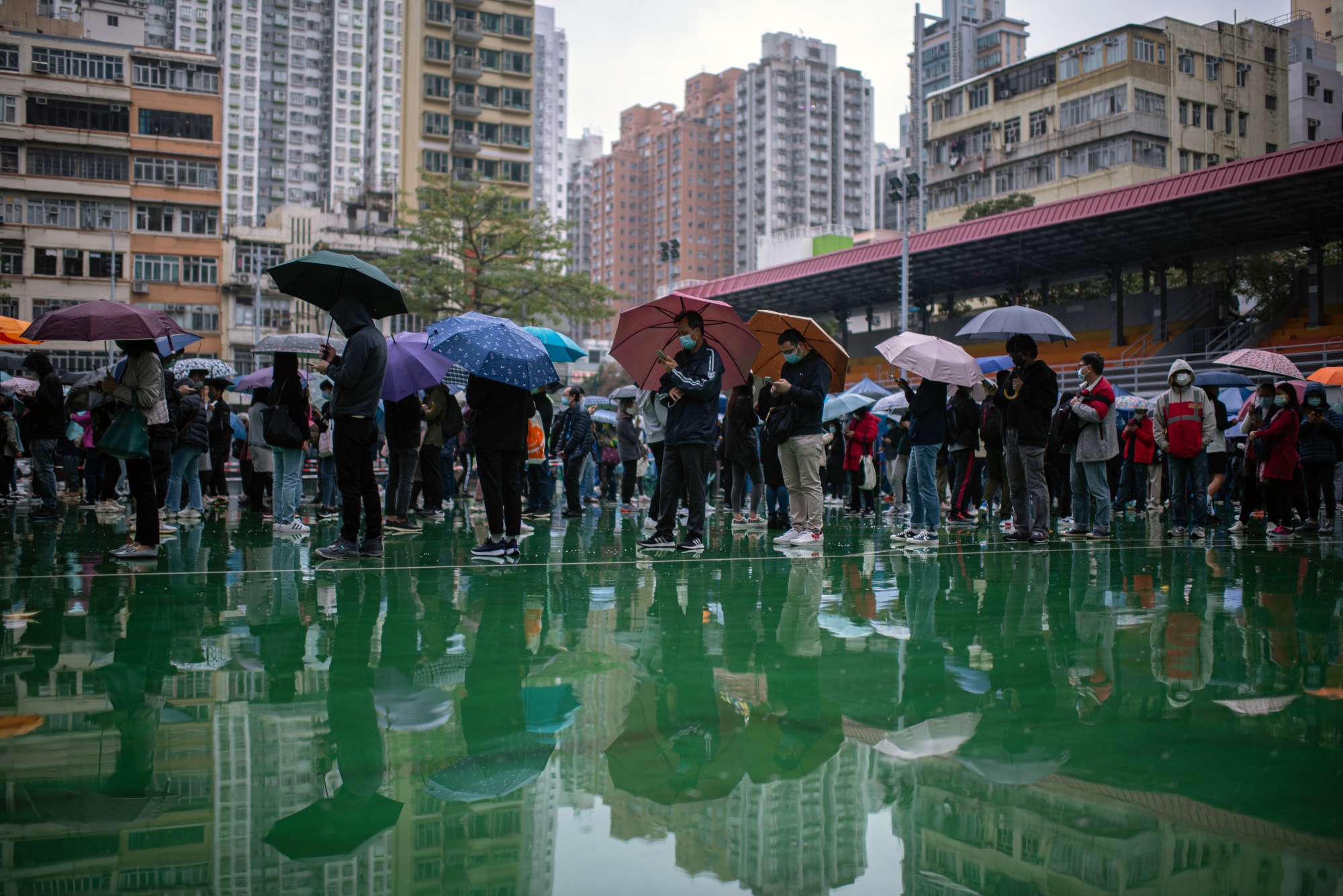 Residents queue at a Covid-19 testing facility in Hong Kong, China, on Thursday, Feb. 17, 2022. 