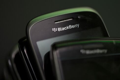 The BlackBerry Logo Sits on a BlackBerry Smartphone