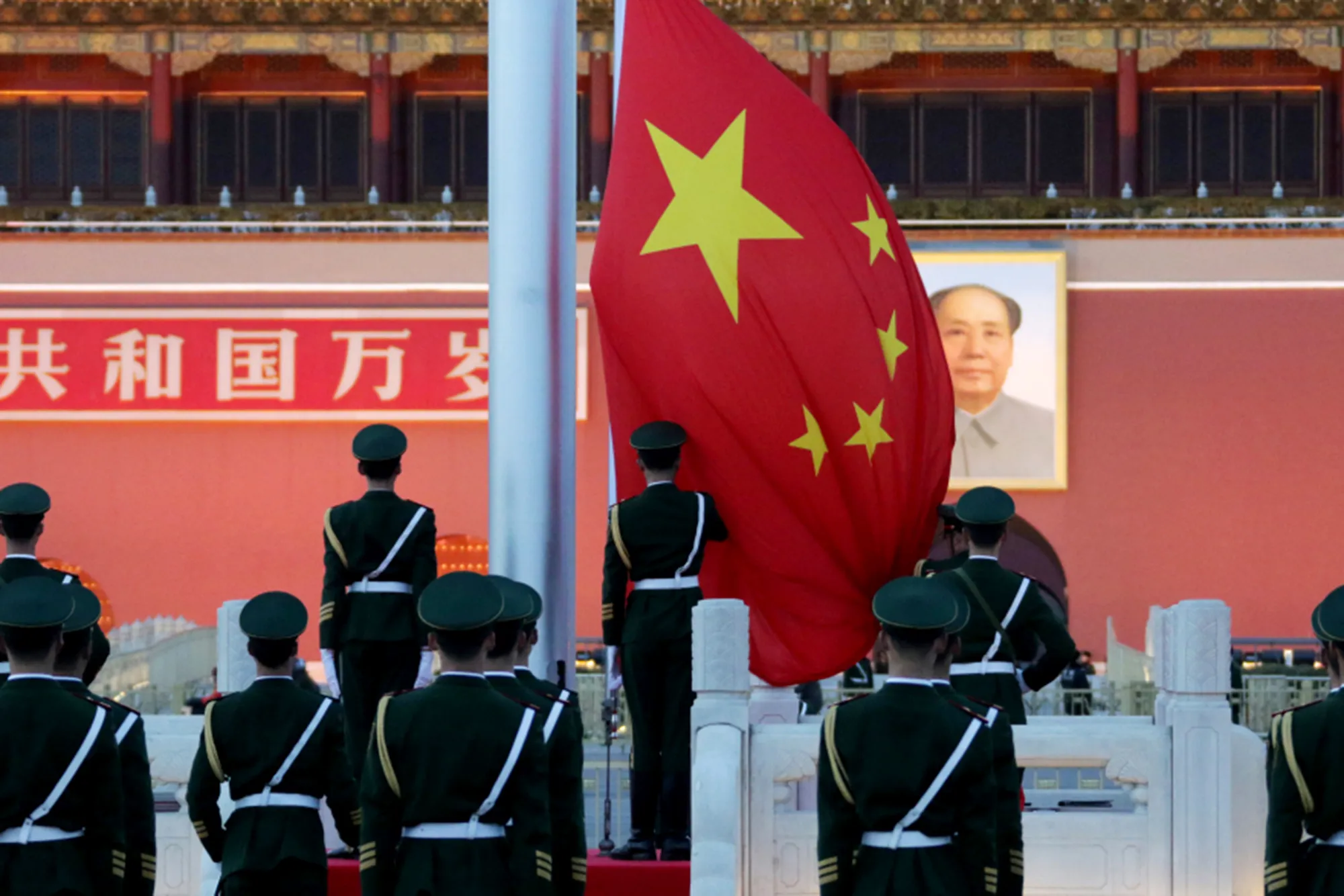 Paramilitary police officers stand during the daily national flag-lowering ceremony at Tiananmen Square in Beijing.