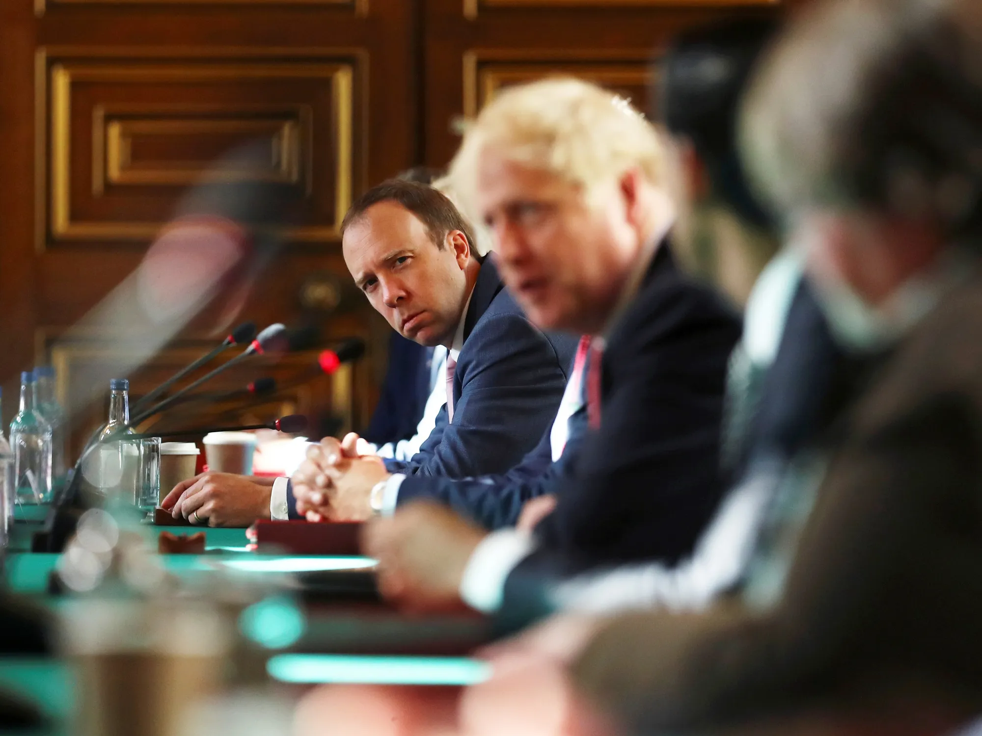 Matt Hancock listens as Boris Johnson chairs a cabinet meeting in 2020.