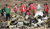 Forensics investigators and recovery teams collect personal effects and other materials from the crash site of Ethiopian Airlines Flight ET 302 on March 12, 2019 in Bishoftu, Ethiopia.