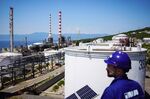 An employee looks out from a platform at the INA Industrija Nafte d.d. oil refinery in Urinj, Croatia.
