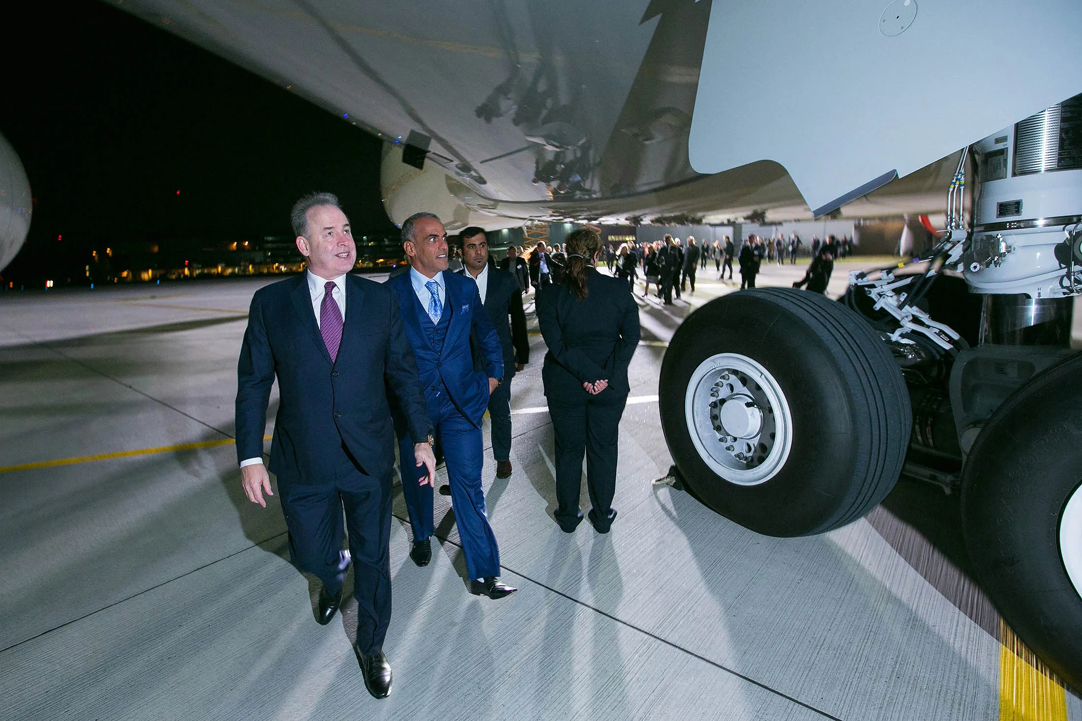 James Hogan, left, walks beneath an Etihad Airways' Airbus A380-800 aircraft.
