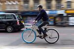 A customer rides a Dutch-style Swapfiets bikes&nbsp;on Oct. 4 in London.