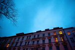 Lights in the windows of a residential housing block located in Berlin.